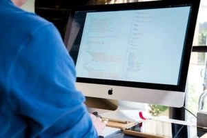 Developer coding on computer