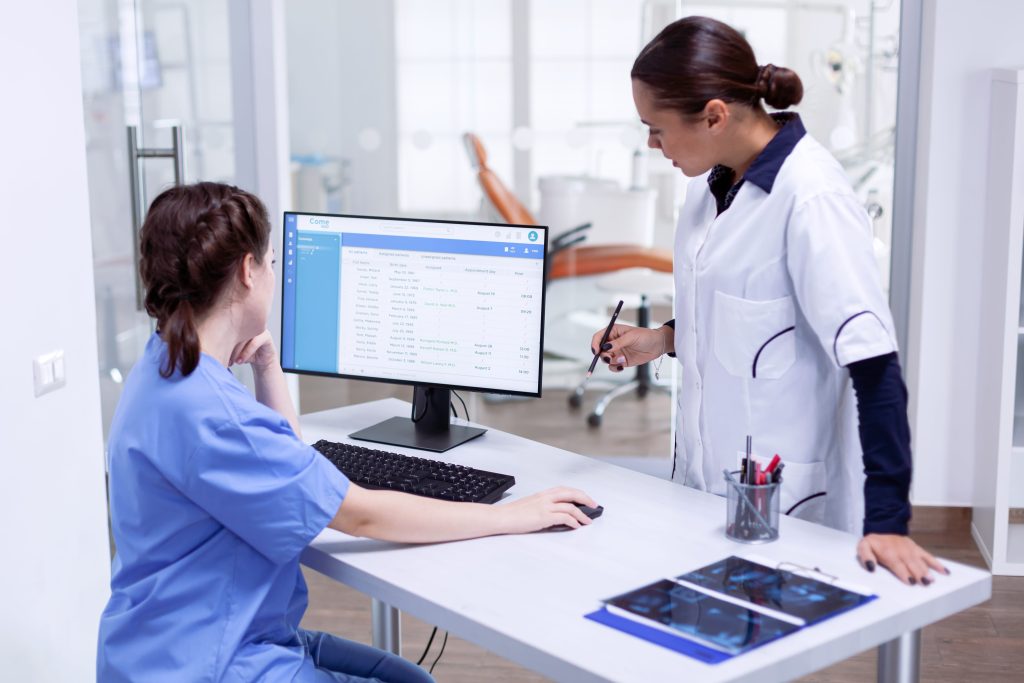 Nurses reviewing digital charts